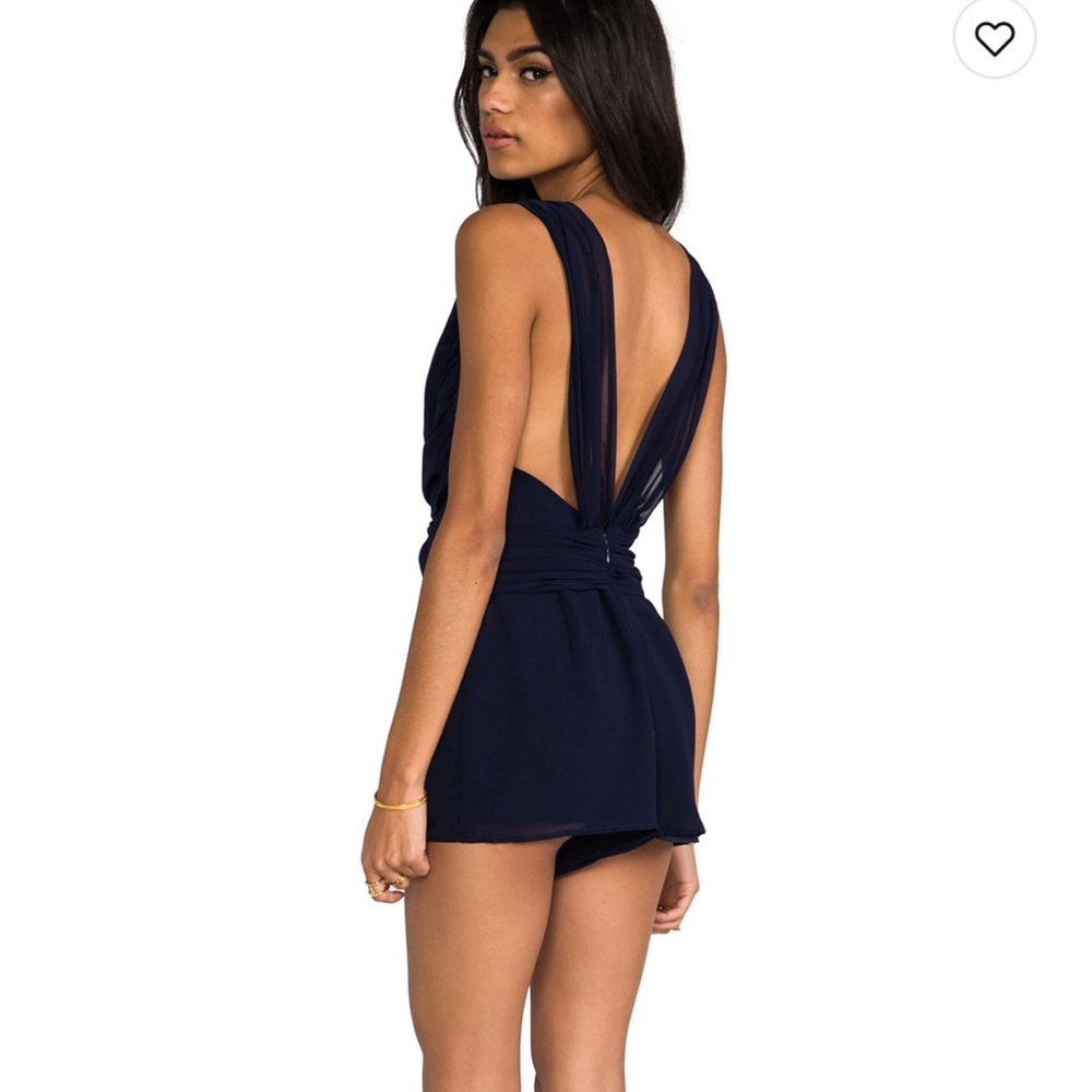 Open back romper. Size small but fits more like an extra small.